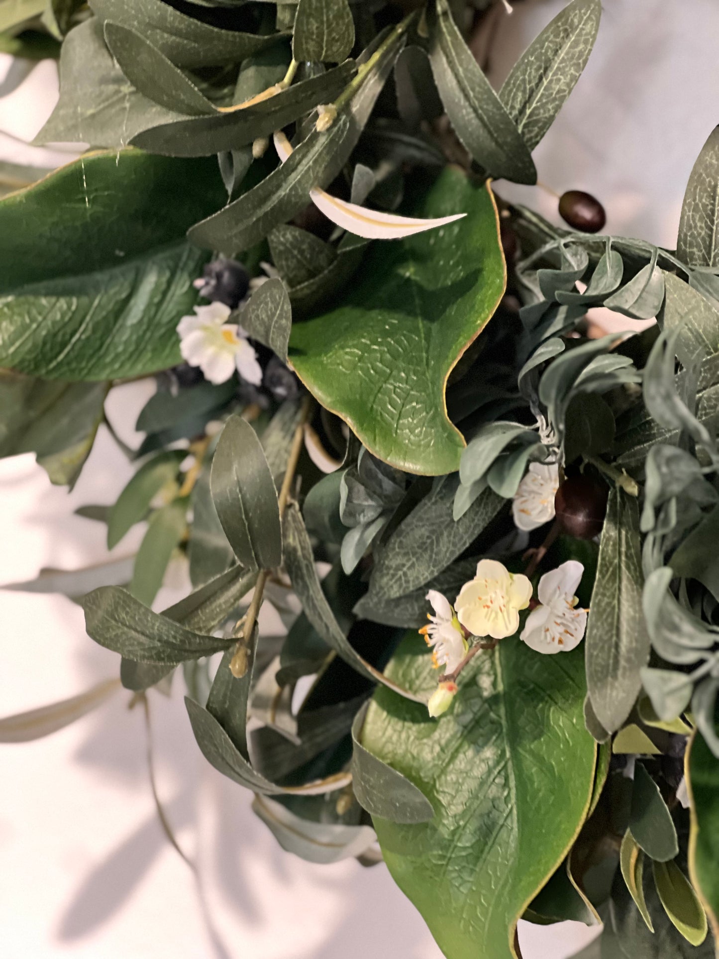 All Season Greenery with olive branches, summer leaves, blueberries, whitr flowers