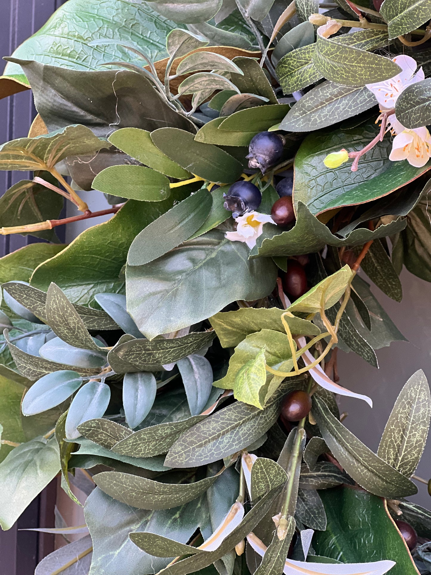 All Season Greenery with olive branches, summer leaves, blueberries, whitr flowers