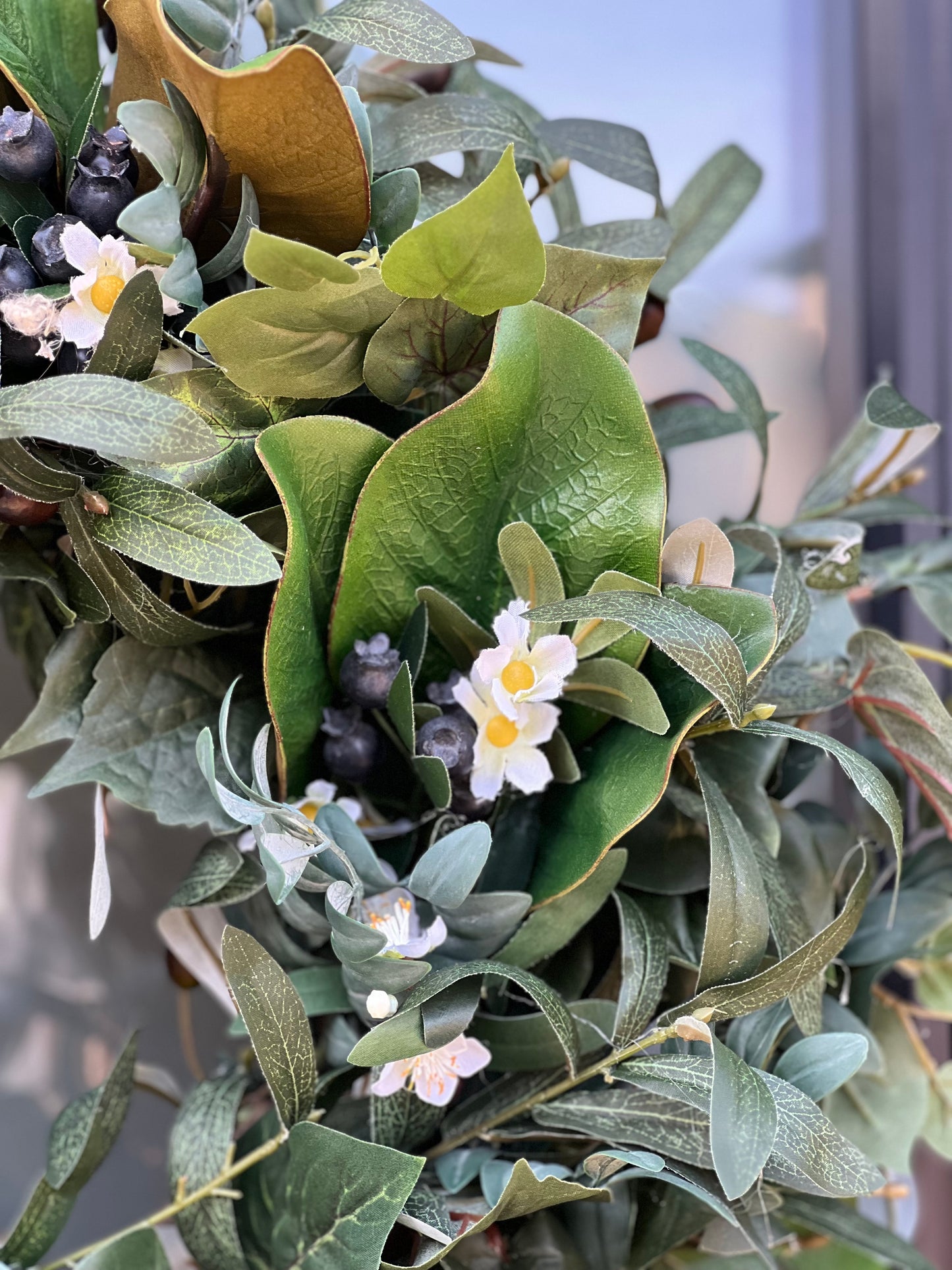 All Season Greenery with olive branches, summer leaves, blueberries, whitr flowers