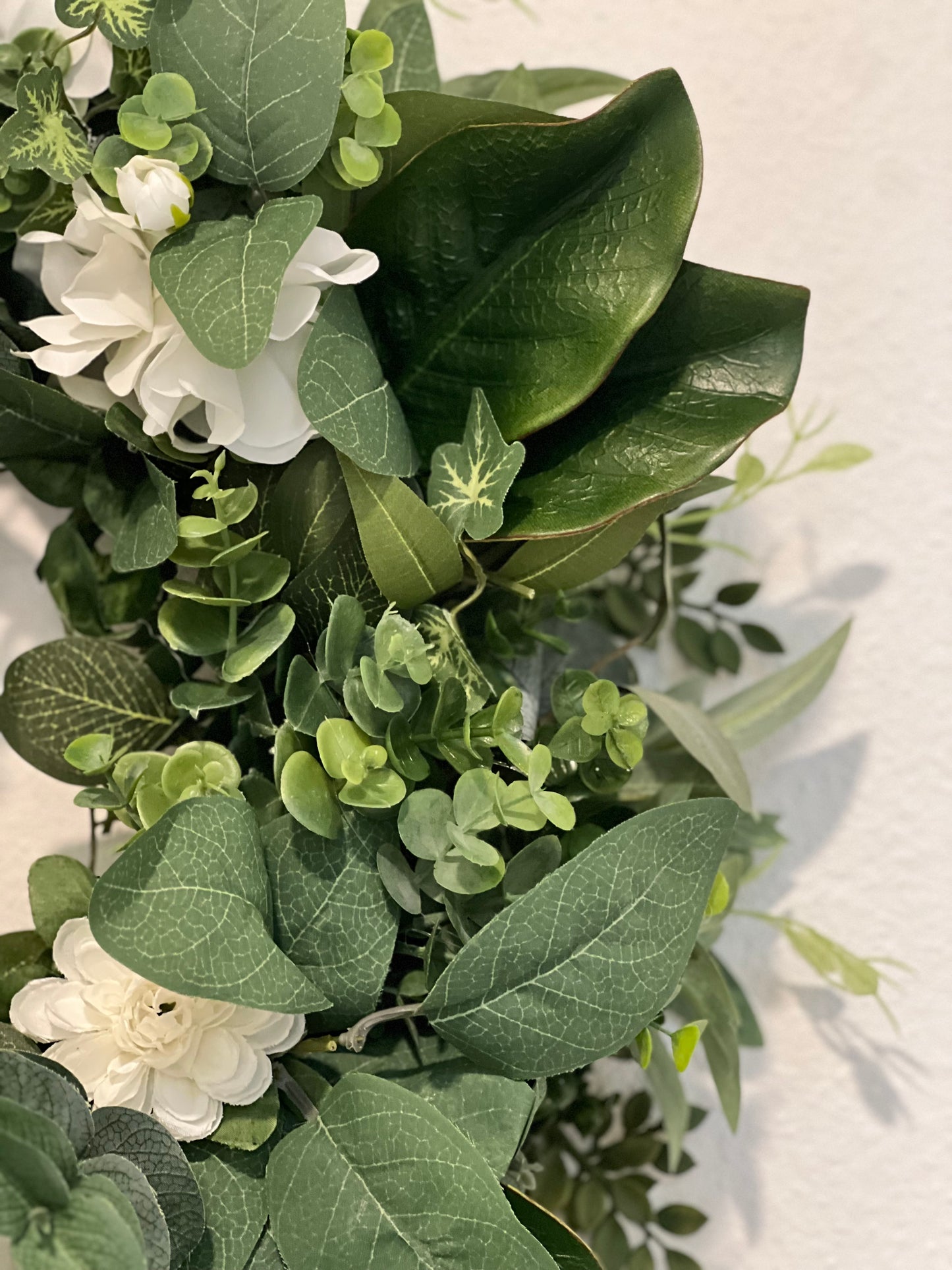 All Season Greenery with olive branches, summer leaves, blueberries, whitr flowers